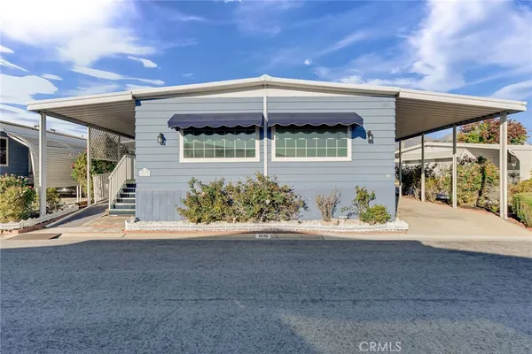 a front view of a house with a outdoor space