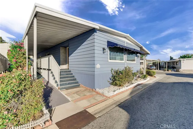 a view of a house with a street