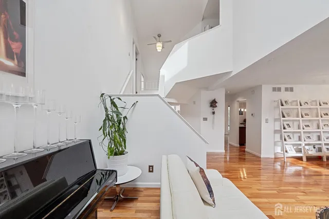 a view of a living room and workspace