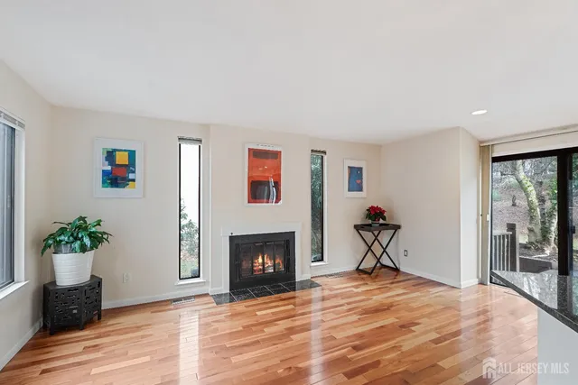 a bedroom with a bed and a fireplace