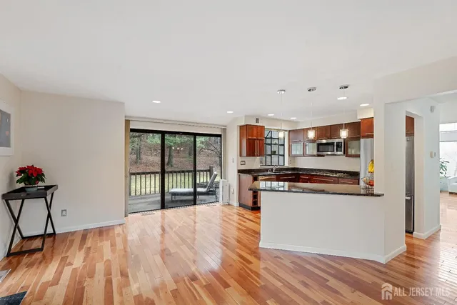 a kitchen with stainless steel appliances granite countertop a stove and a refrigerator