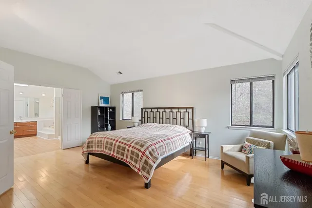 a bedroom with a bed and a couch