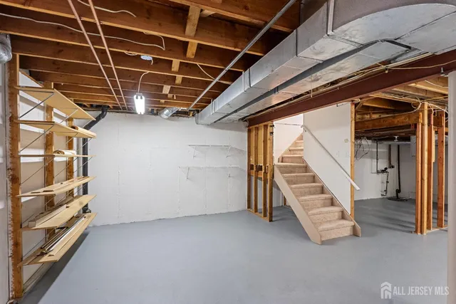 a view of an empty room with stairs