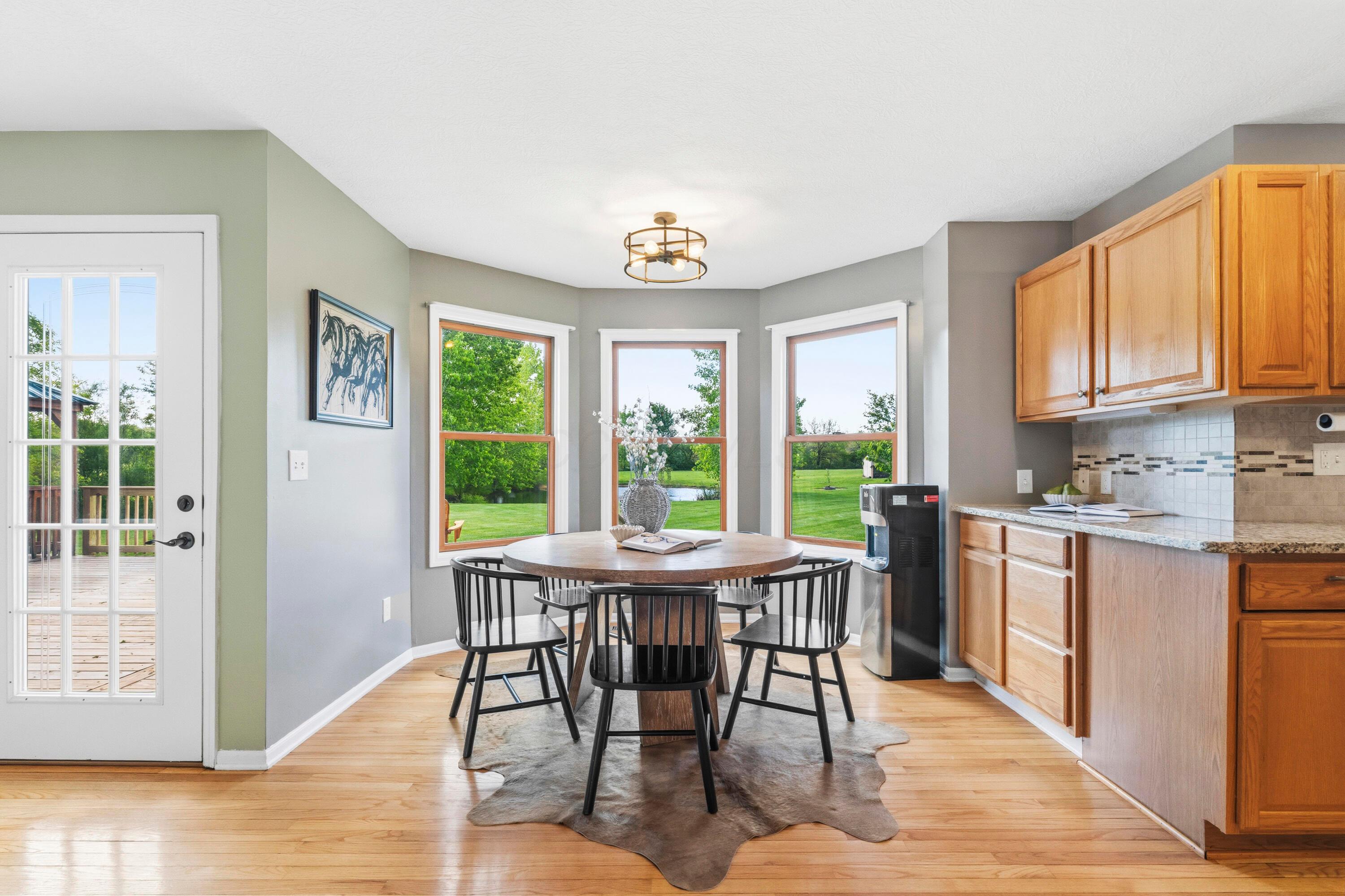 8507 Benner Road Johnstown, OH 43031 - Photo 16 of 69 Dining Room with bay window and updated lighting!