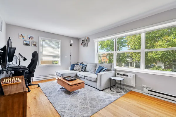 a living room with furniture and a window