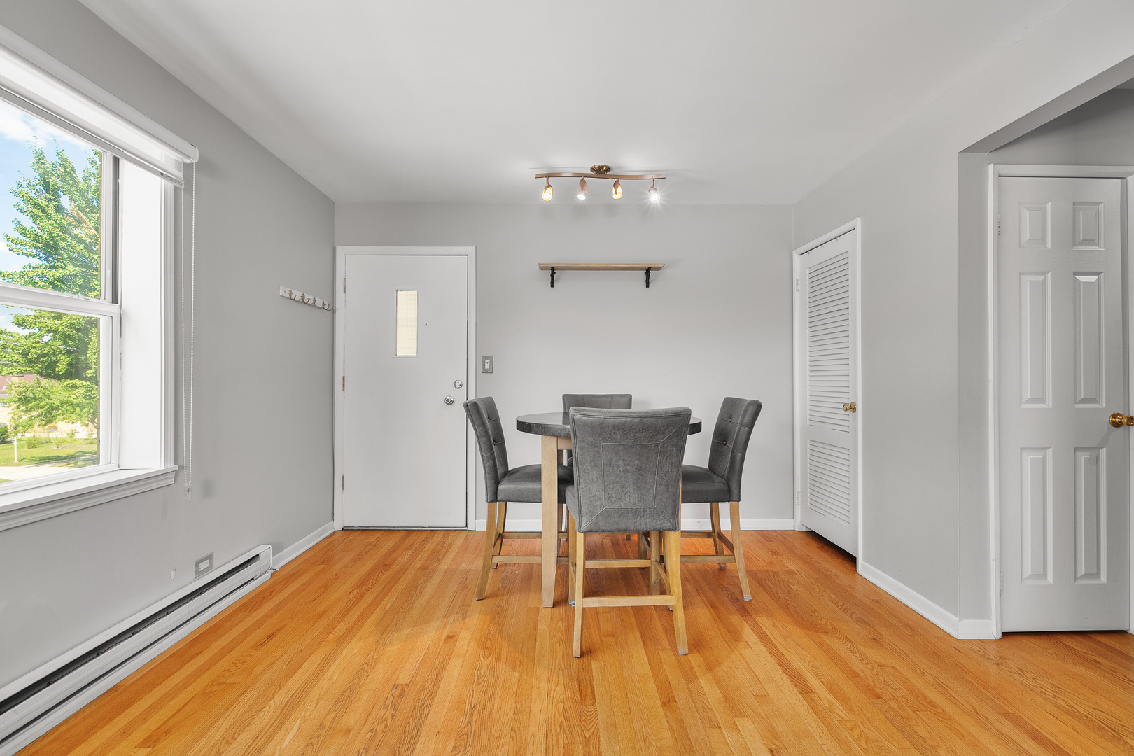 1415 Homestead Road, Unit 8 La Grange Park, IL 60526 - Photo 7 of 16 a view of a dining room with furniture and wooden floor