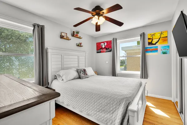 a bedroom with a bed and a table