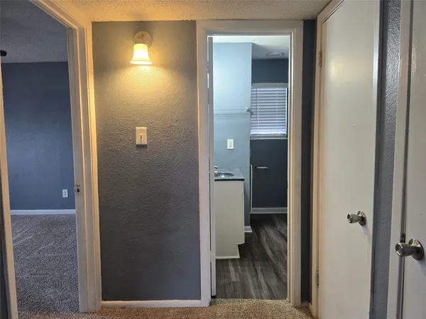 a view of a livingroom and a bathroom