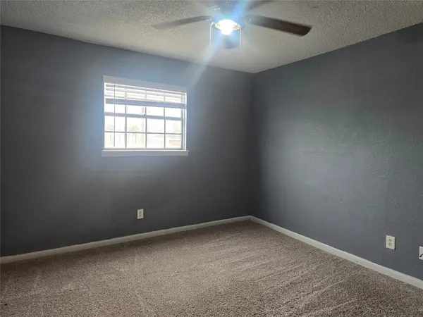 an empty room with a empty space and a window