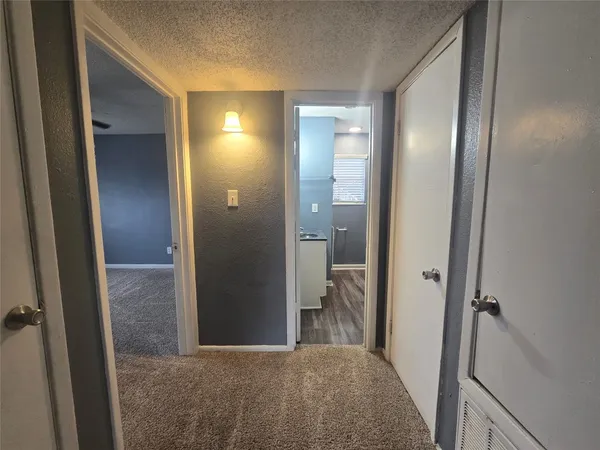 a view of a bathroom from a hallway