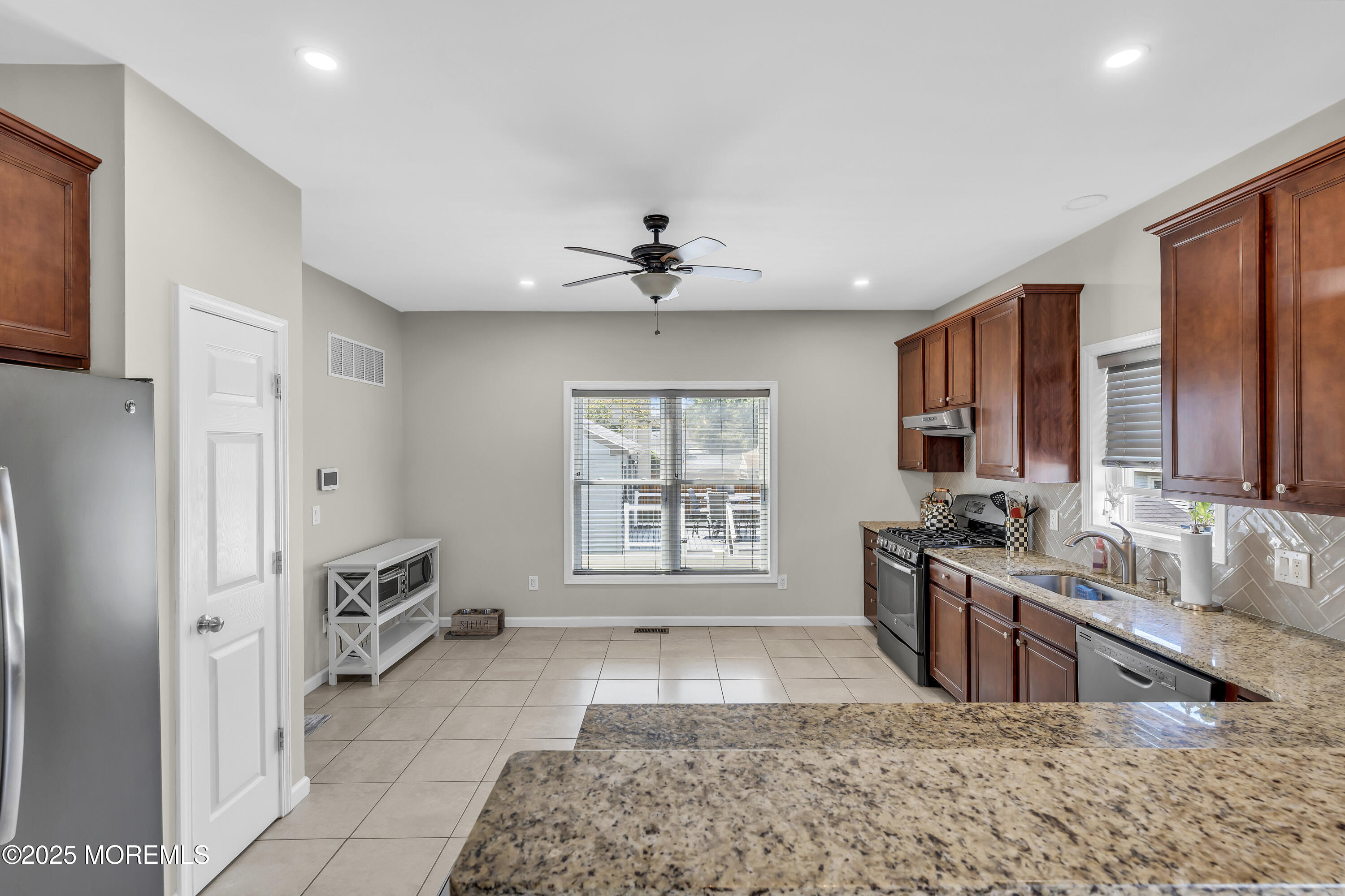 31 Ocean Avenue Middletown, NJ 07748 - Photo 13 of 39 a large white kitchen with a large window