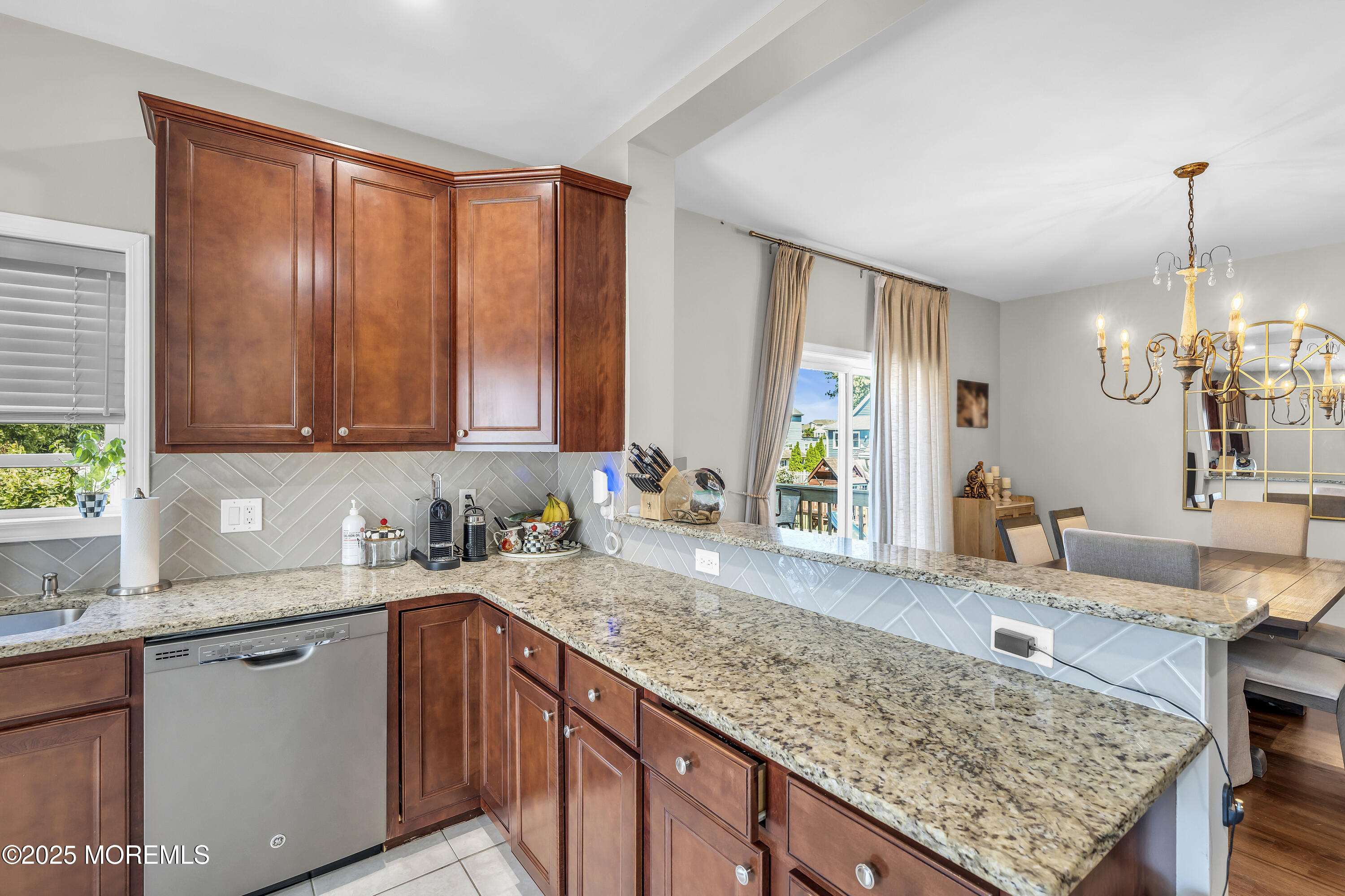 31 Ocean Avenue Middletown, NJ 07748 - Photo 14 of 39 a kitchen with a sink a counter top space and living room