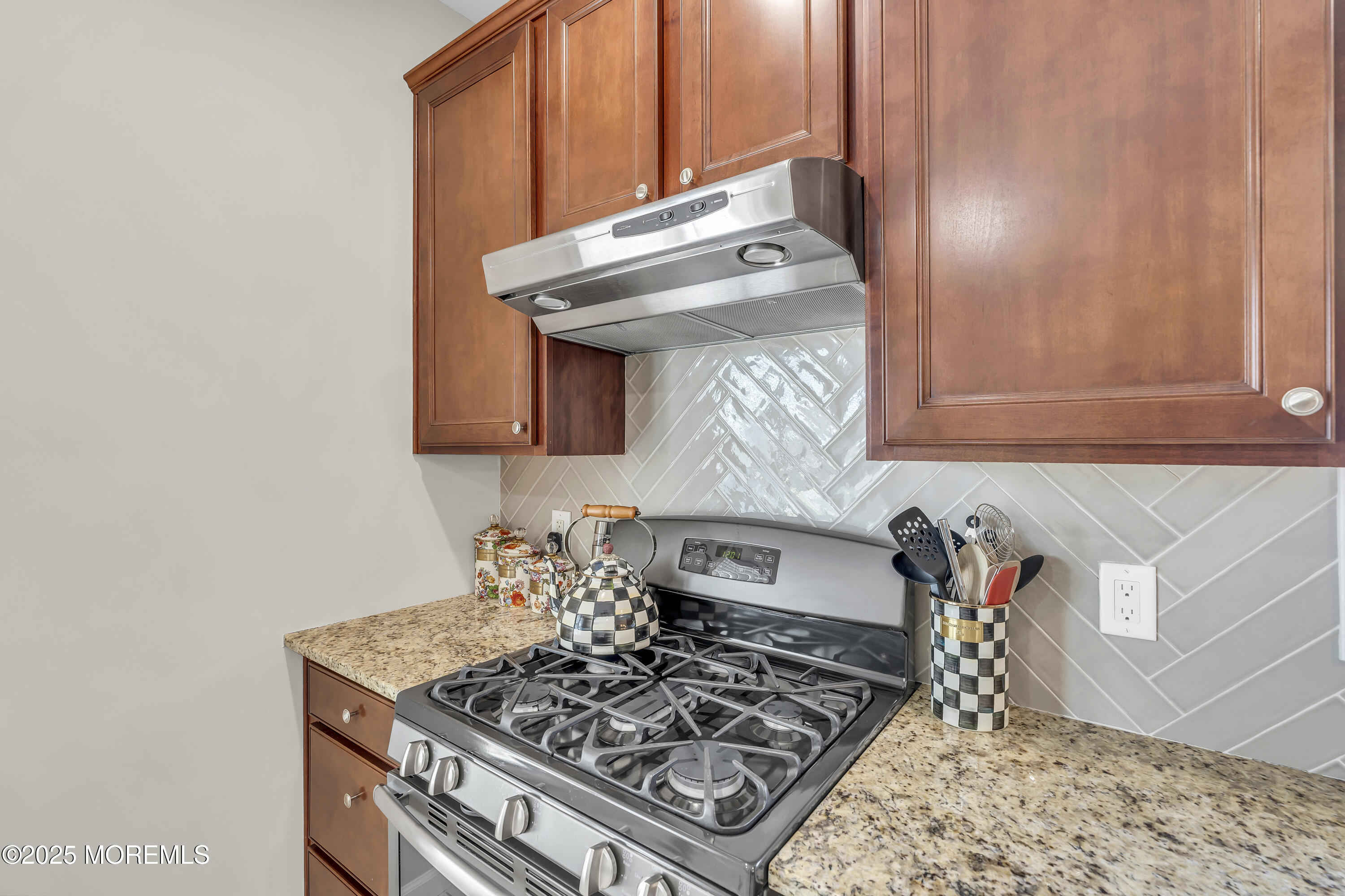 31 Ocean Avenue Middletown, NJ 07748 - Photo 17 of 39 a kitchen with a stove and a microwave