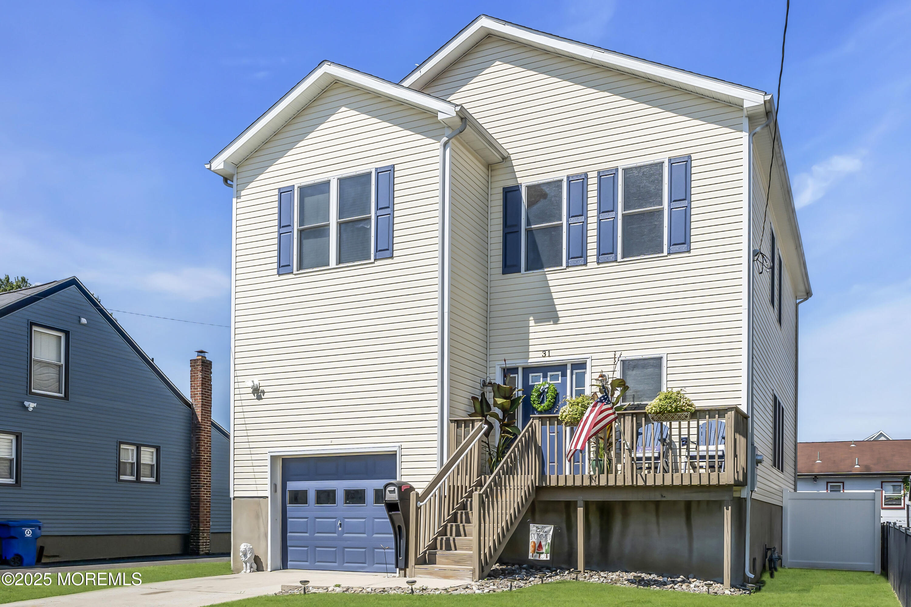 31 Ocean Avenue Middletown, NJ 07748 - Photo 2 of 39 a front view of a house with a garage