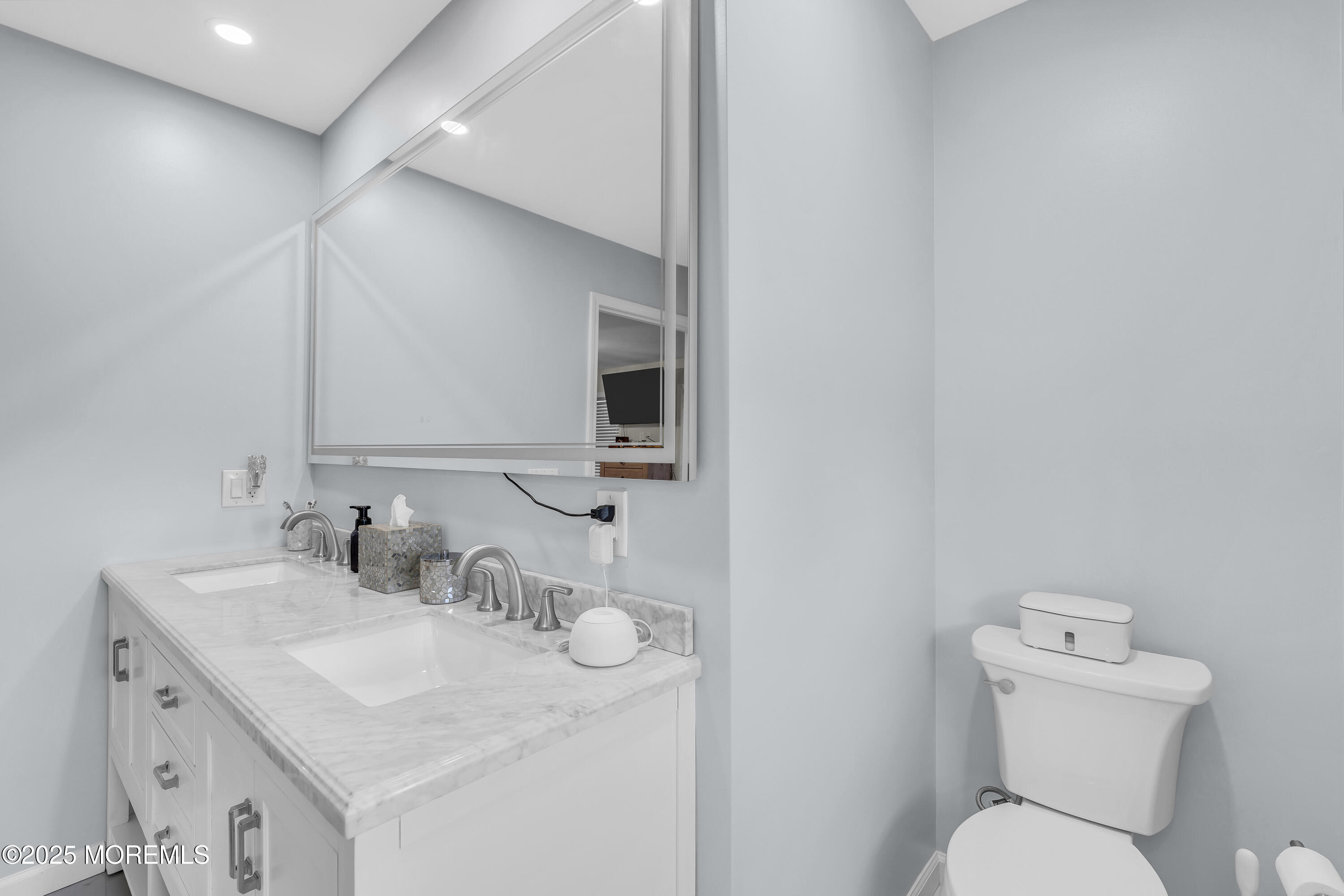 31 Ocean Avenue Middletown, NJ 07748 - Photo 25 of 39 a bathroom with a toilet sink and mirror