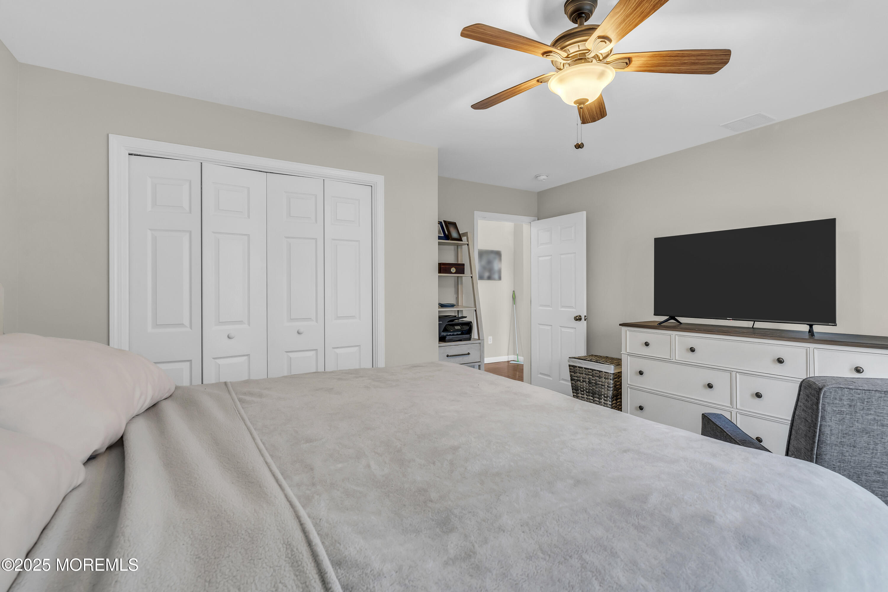 31 Ocean Avenue Middletown, NJ 07748 - Photo 28 of 39 a bedroom with a bed and a flat screen tv