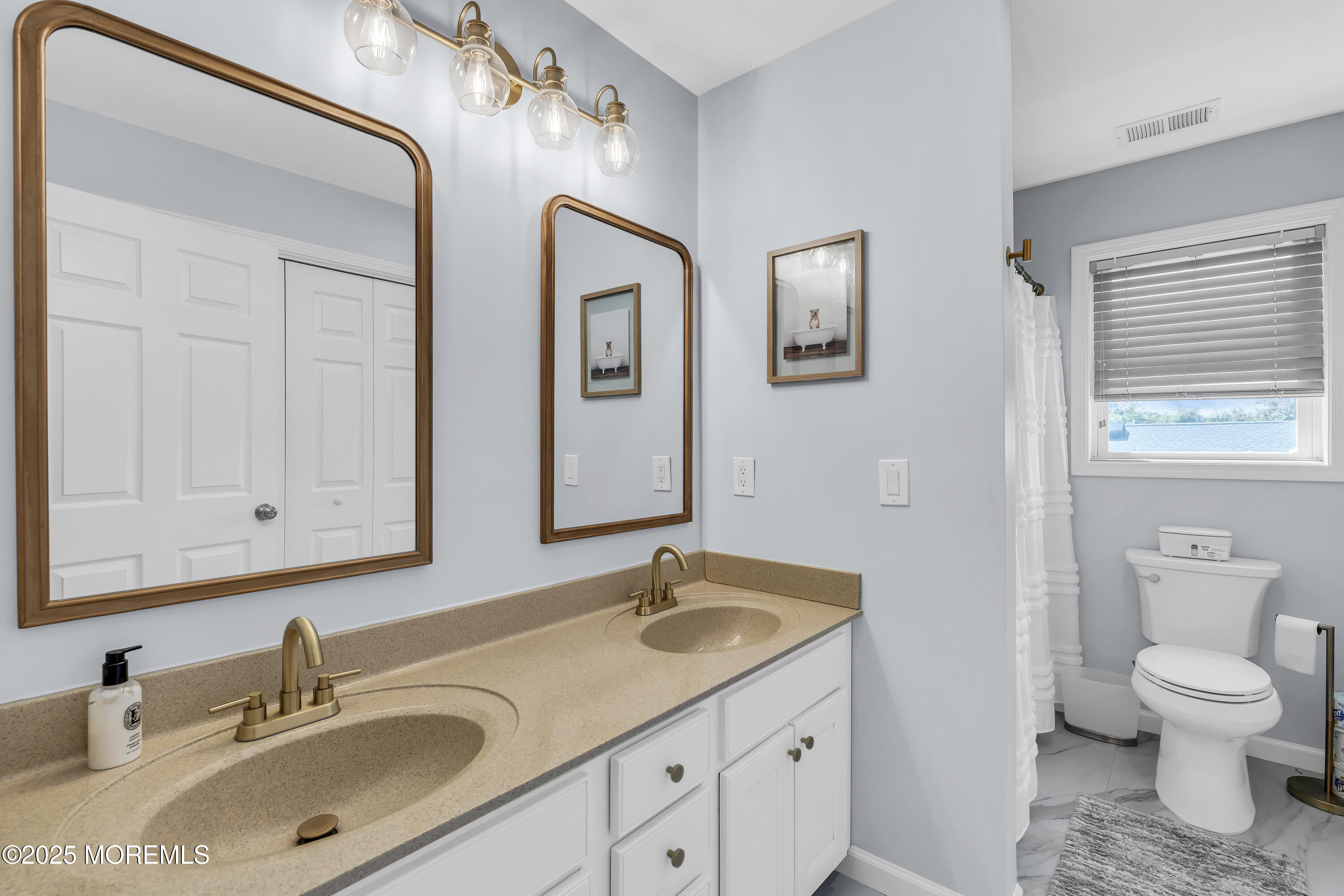 31 Ocean Avenue Middletown, NJ 07748 - Photo 29 of 39 a bathroom with a granite countertop sink a toilet and a mirror