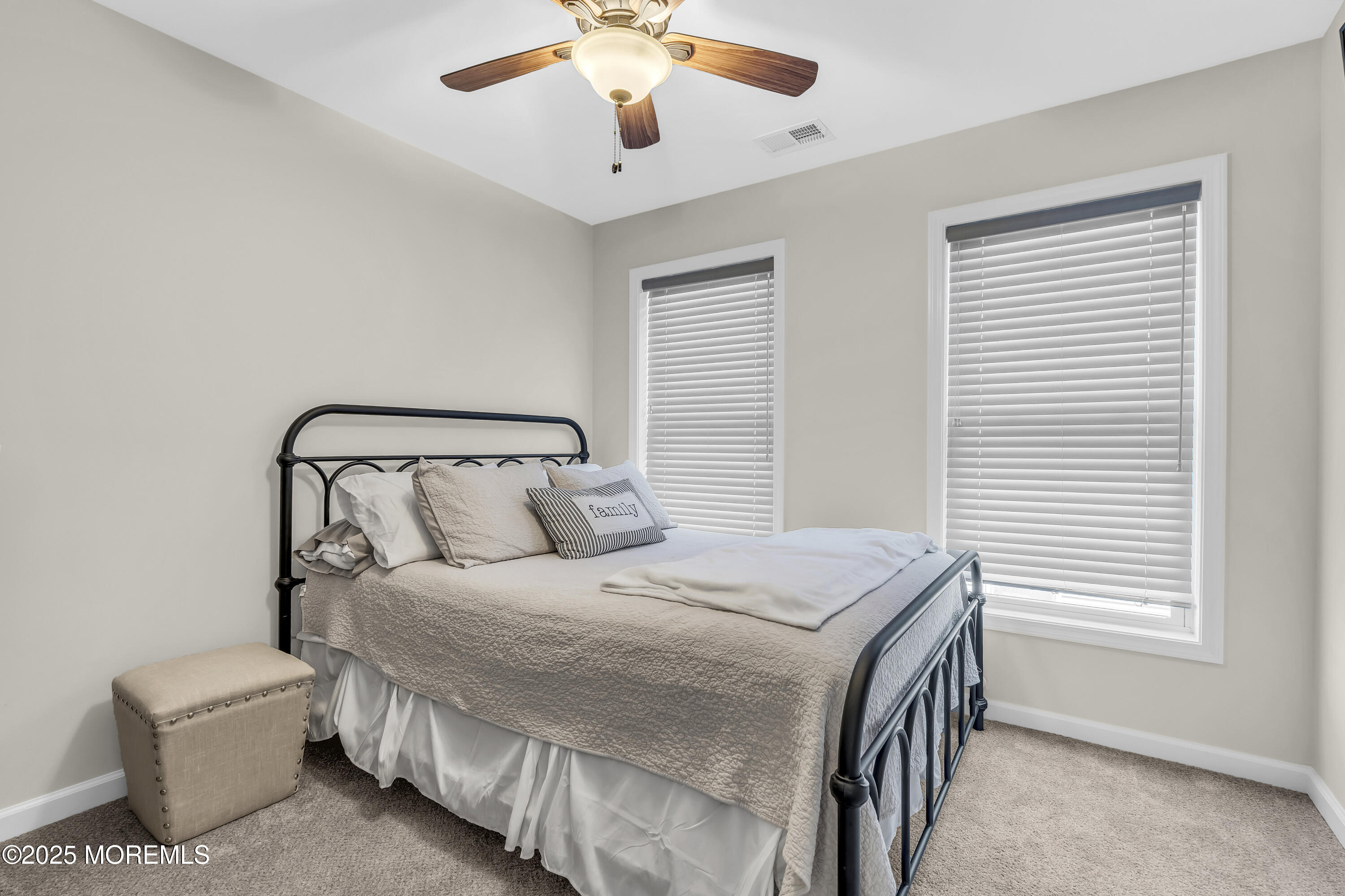 31 Ocean Avenue Middletown, NJ 07748 - Photo 30 of 39 a bedroom with a bed and a chandelier