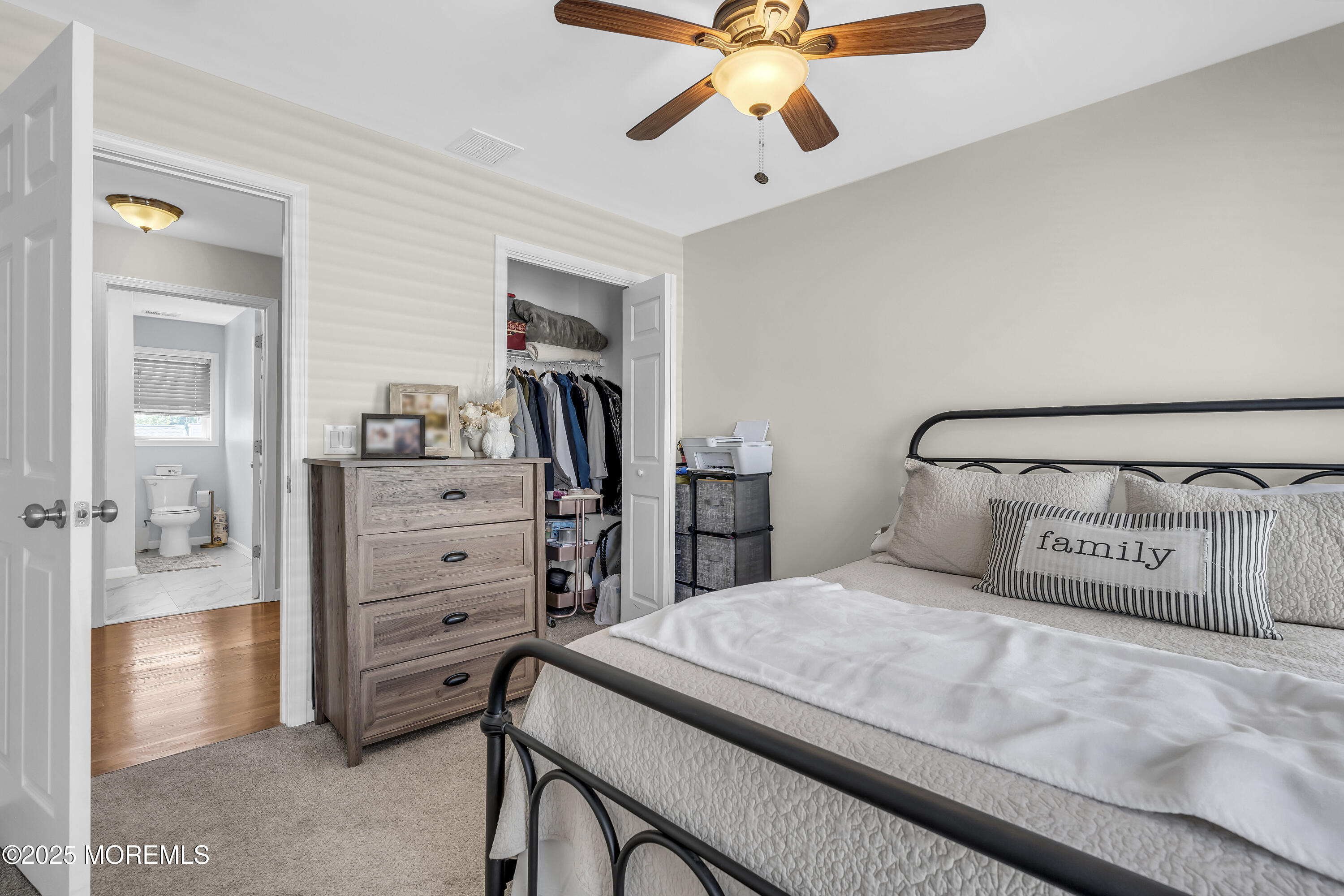 31 Ocean Avenue Middletown, NJ 07748 - Photo 31 of 39 a bedroom with a bed and a chandelier