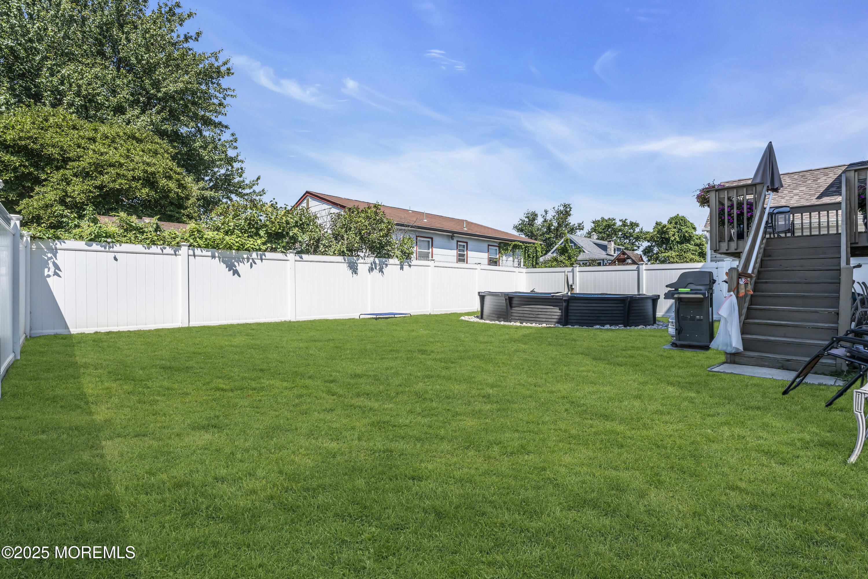 31 Ocean Avenue Middletown, NJ 07748 - Photo 33 of 39 a view of yard with swimming pool and green space