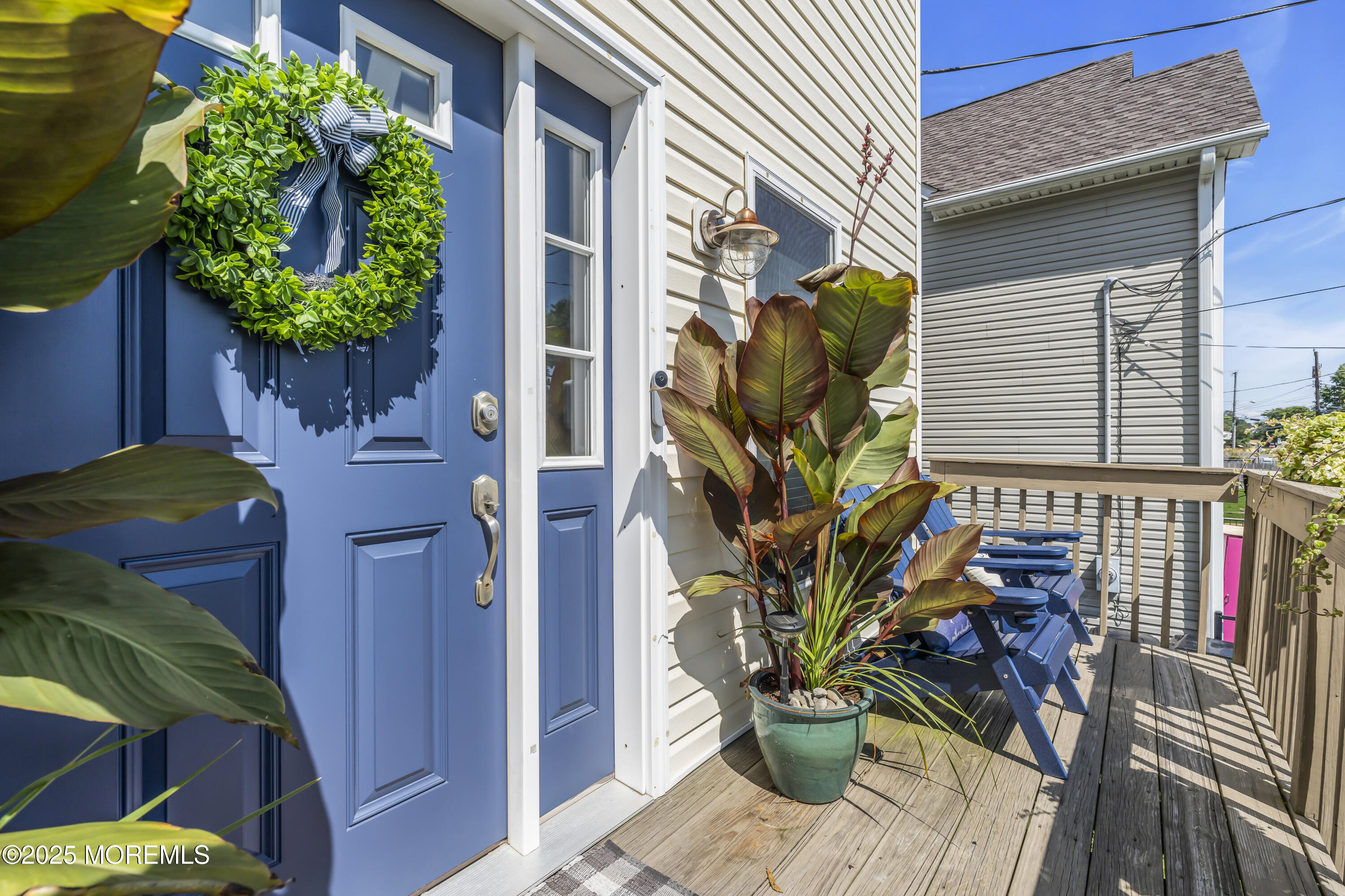 31 Ocean Avenue Middletown, NJ 07748 - Photo 5 of 39 a potted plant sitting in front of a house