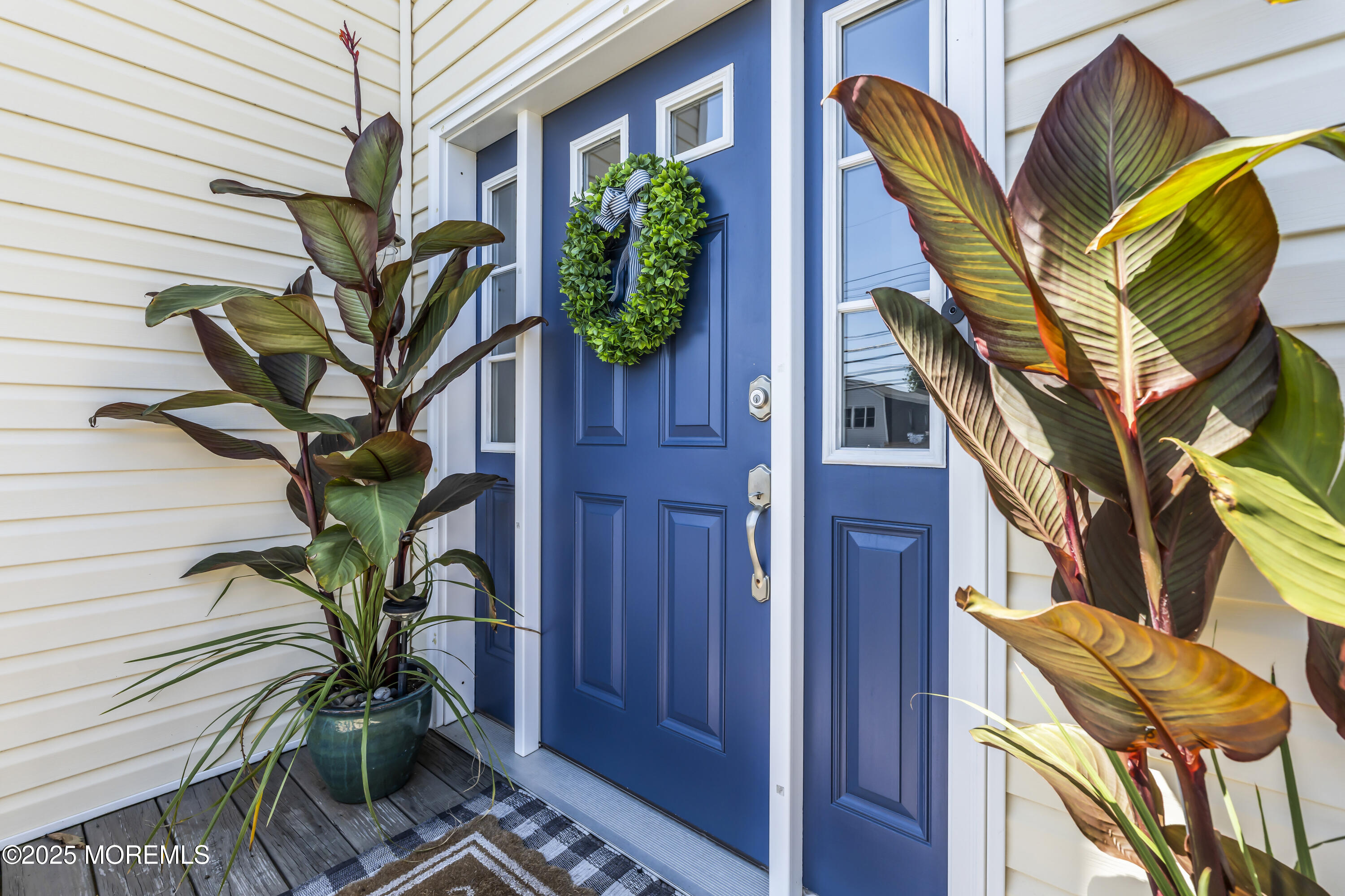 31 Ocean Avenue Middletown, NJ 07748 - Photo 6 of 39 a plant is sitting in front of a door