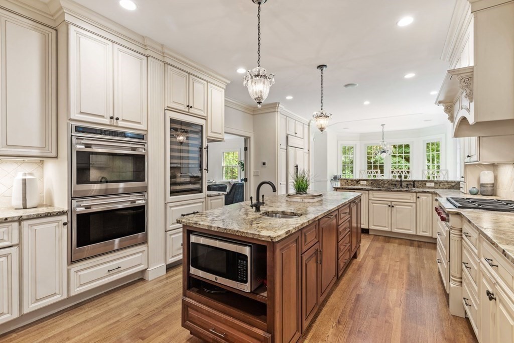 36 Audubon Road Wellesley, MA 02481 - Photo 15 of 40 a kitchen with stainless steel appliances granite countertop a stove a sink and a refrigerator