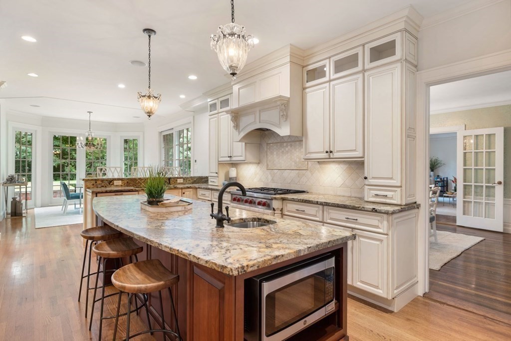 36 Audubon Road Wellesley, MA 02481 - Photo 17 of 40 a kitchen with stainless steel appliances granite countertop a stove and a wooden floors