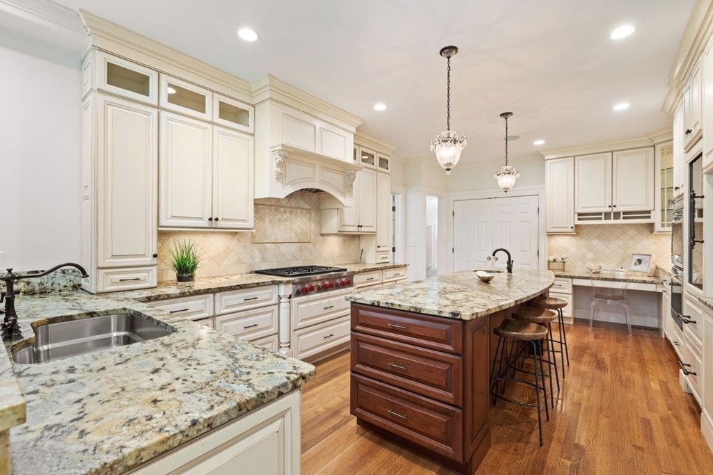 36 Audubon Road Wellesley, MA 02481 - Photo 19 of 40 a kitchen with stainless steel appliances granite countertop a sink stove and refrigerator