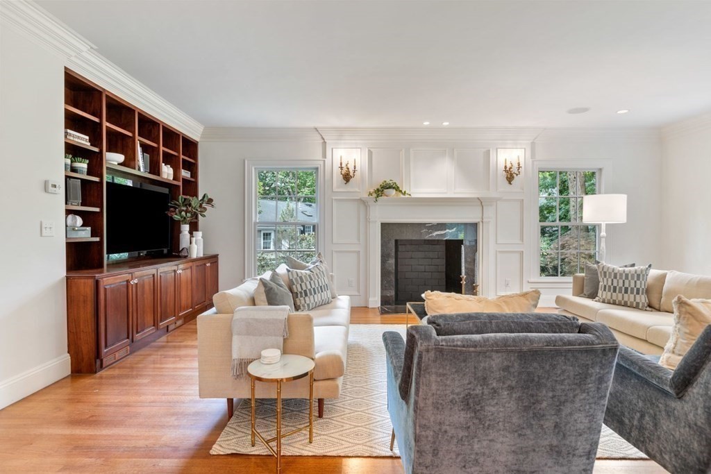 36 Audubon Road Wellesley, MA 02481 - Photo 26 of 40 a living room with furniture a flat screen tv and a fireplace