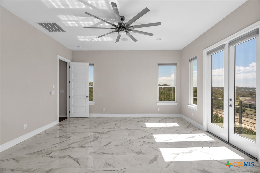 142 Wizard Way Spring Branch, TX 78070 - Photo 19 of 48 a view of an empty room with a window