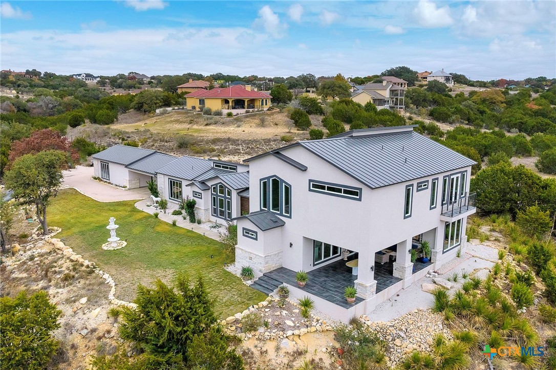 142 Wizard Way Spring Branch, TX 78070 - Photo 2 of 48 an aerial view of residential houses with yard and mountain view in back