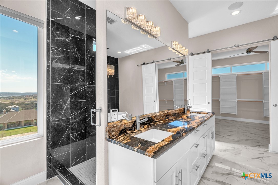 142 Wizard Way Spring Branch, TX 78070 - Photo 23 of 48 a bathroom with a sink and a mirror