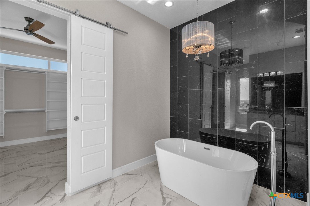 142 Wizard Way Spring Branch, TX 78070 - Photo 24 of 48 a bathroom with a sink a toilet and a shower