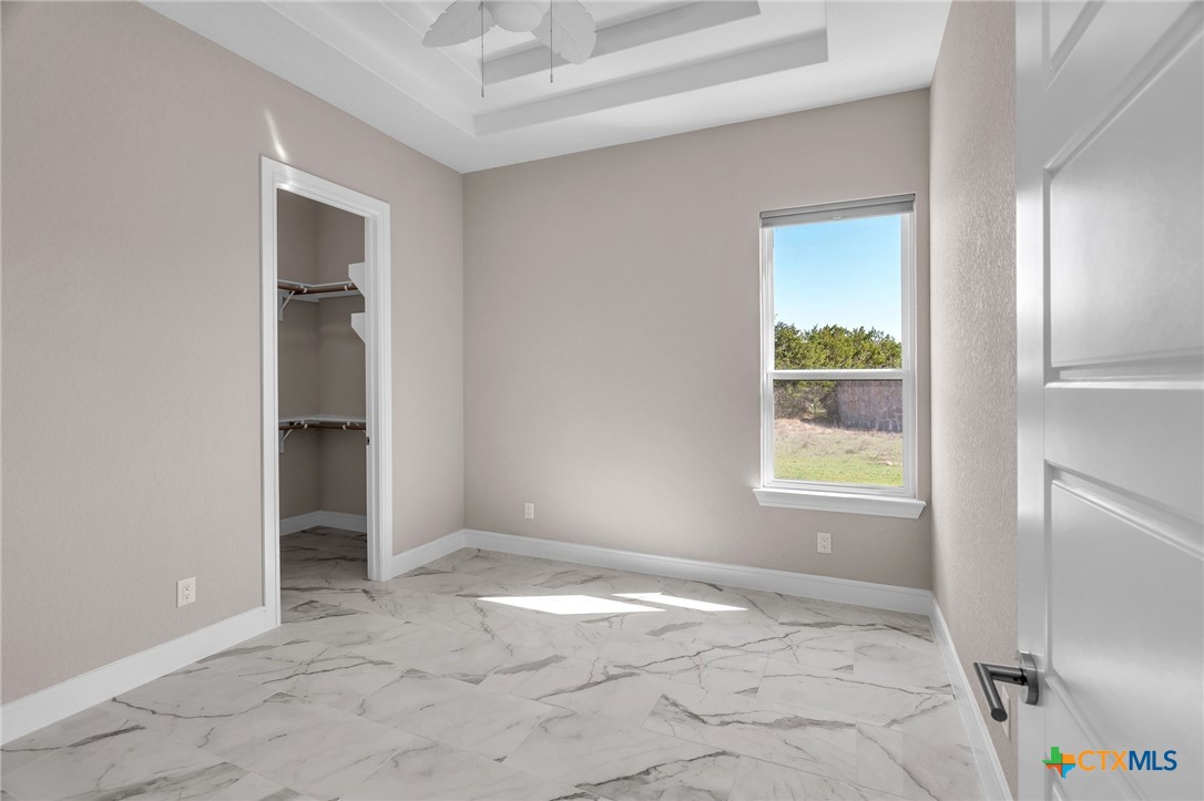 142 Wizard Way Spring Branch, TX 78070 - Photo 29 of 48 an empty room with windows and closet