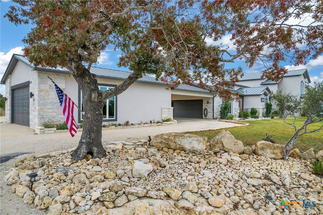 142 Wizard Way Spring Branch, TX 78070 - Photo 3 of 48 a front view of a house with a yard