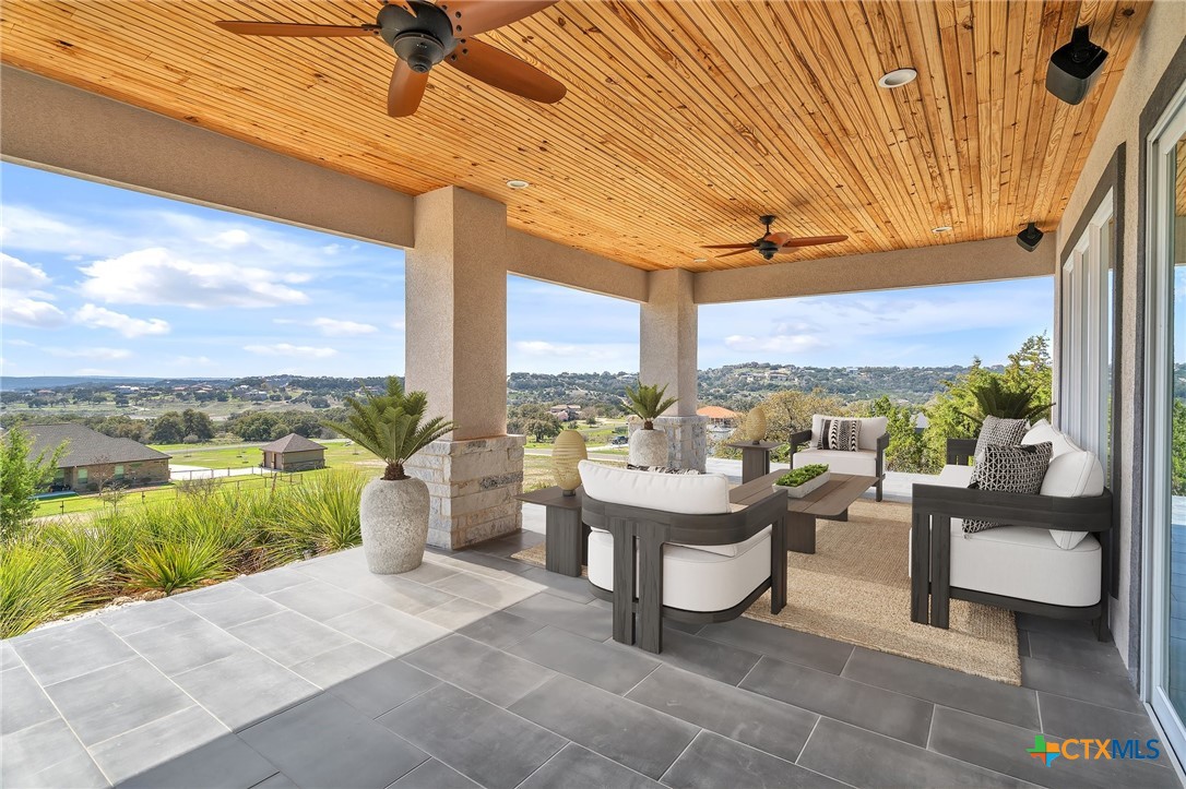 142 Wizard Way Spring Branch, TX 78070 - Photo 35 of 48 a balcony with furniture and a floor to ceiling window