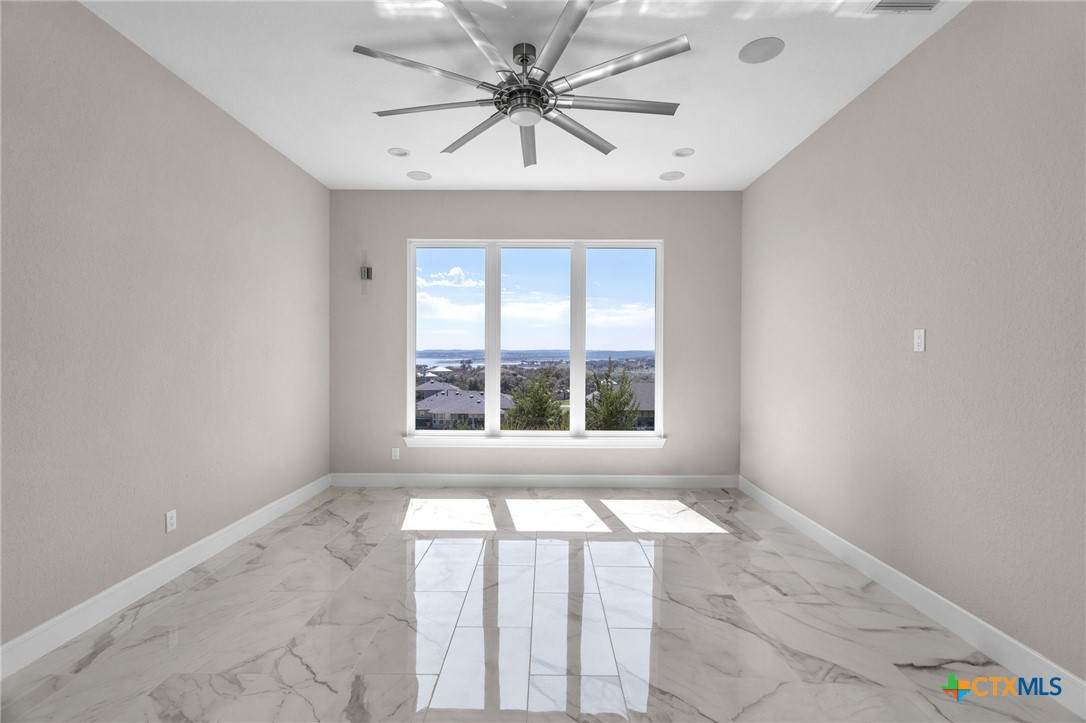 142 Wizard Way Spring Branch, TX 78070 - Photo 9 of 48 a view of an empty room with a window