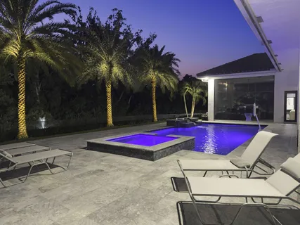a view of swimming pool with chairs