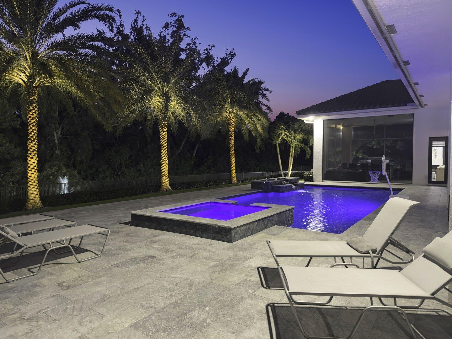 15271 Tall Oak Avenue Delray Beach, FL 33446 - Photo 12 of 60 a view of swimming pool with red chairs