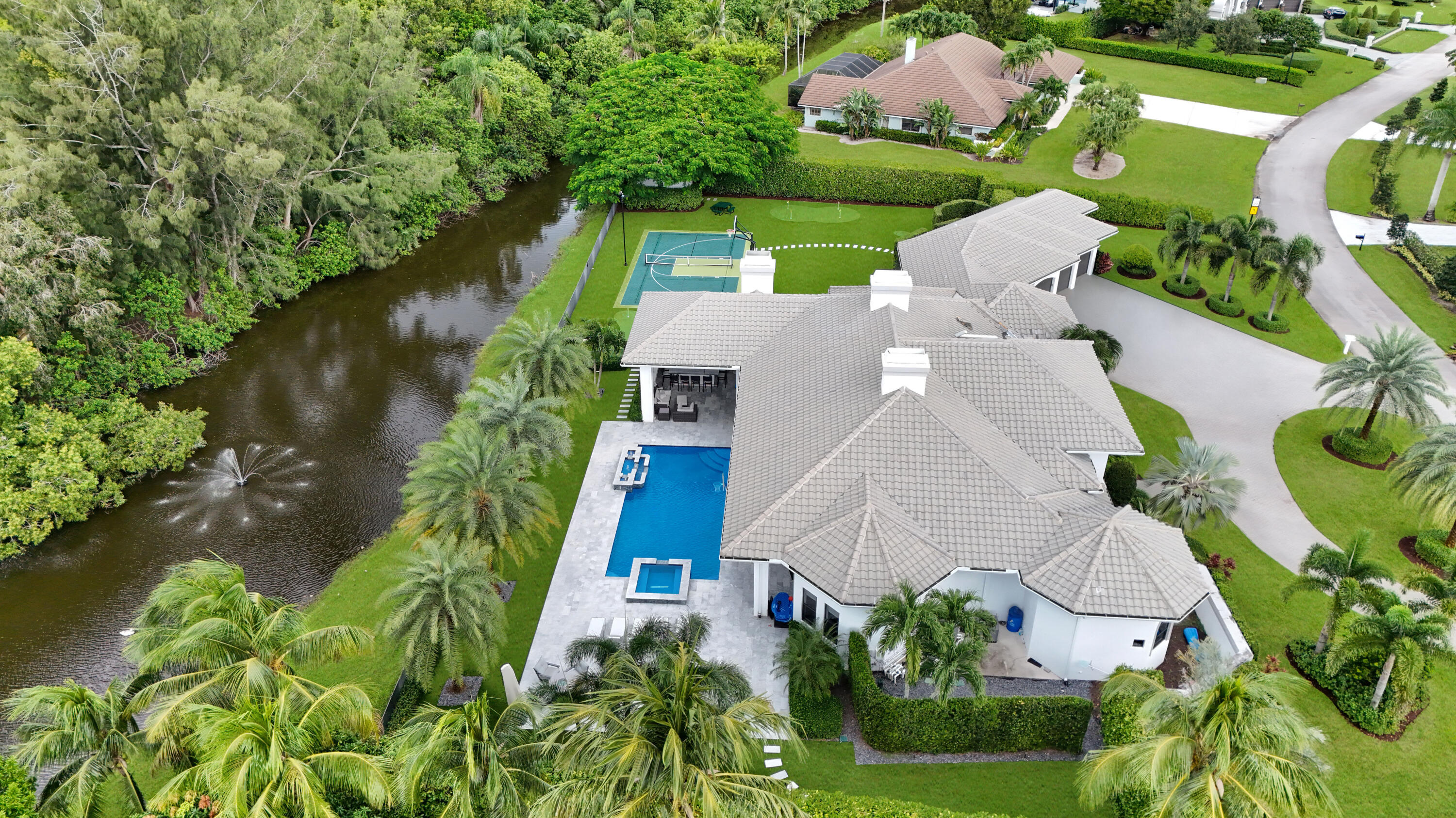 15271 Tall Oak Avenue Delray Beach, FL 33446 - Photo 13 of 60 an aerial view of a house with a yard and garden