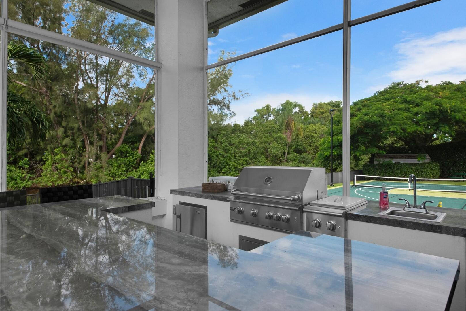 15271 Tall Oak Avenue Delray Beach, FL 33446 - Photo 19 of 60 a view of a patio with a table chairs and a floor to ceiling window