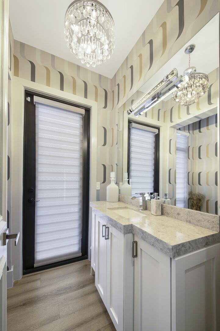 15271 Tall Oak Avenue Delray Beach, FL 33446 - Photo 40 of 60 a bathroom with a sink and a mirror