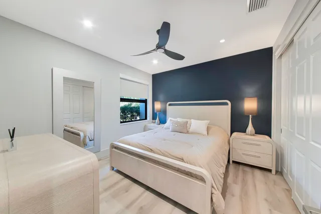 a bedroom with a bed and a couch