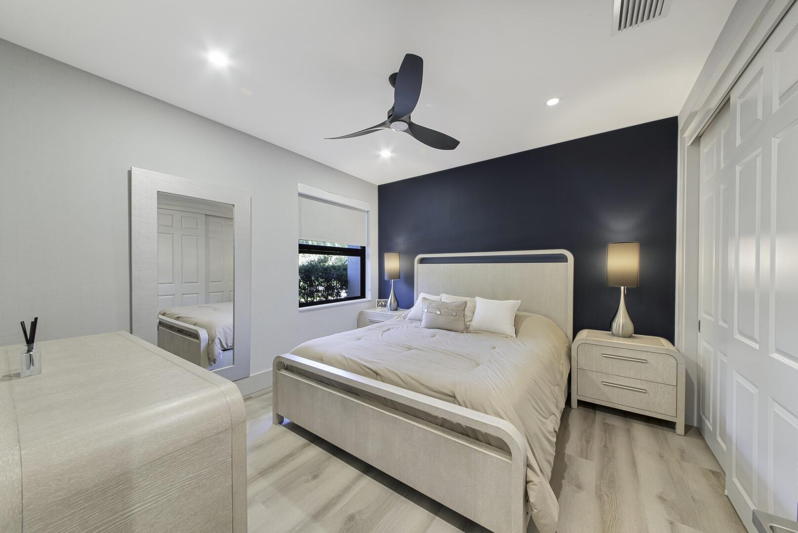 15271 Tall Oak Avenue Delray Beach, FL 33446 - Photo 46 of 60 a bedroom with a bed and a large mirror