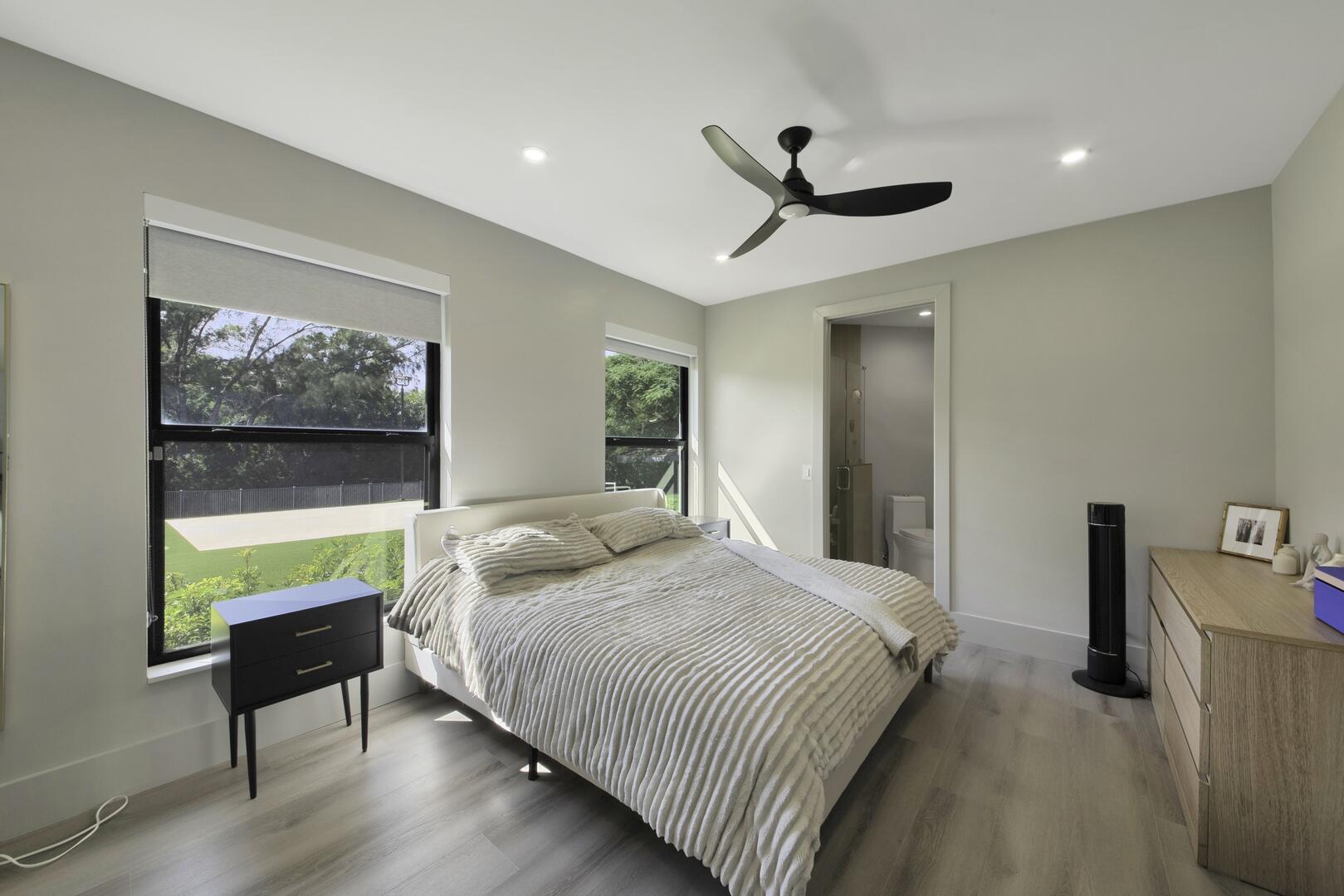 15271 Tall Oak Avenue Delray Beach, FL 33446 - Photo 47 of 60 a bedroom with a bed and a painting on the wall