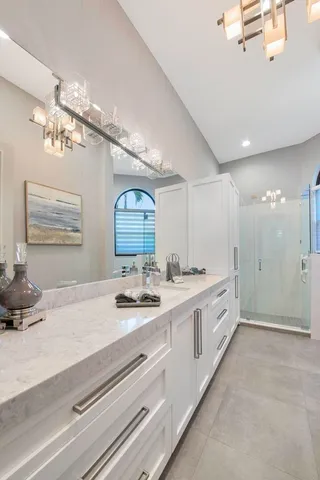 an aerial view of a house with a yard and garden