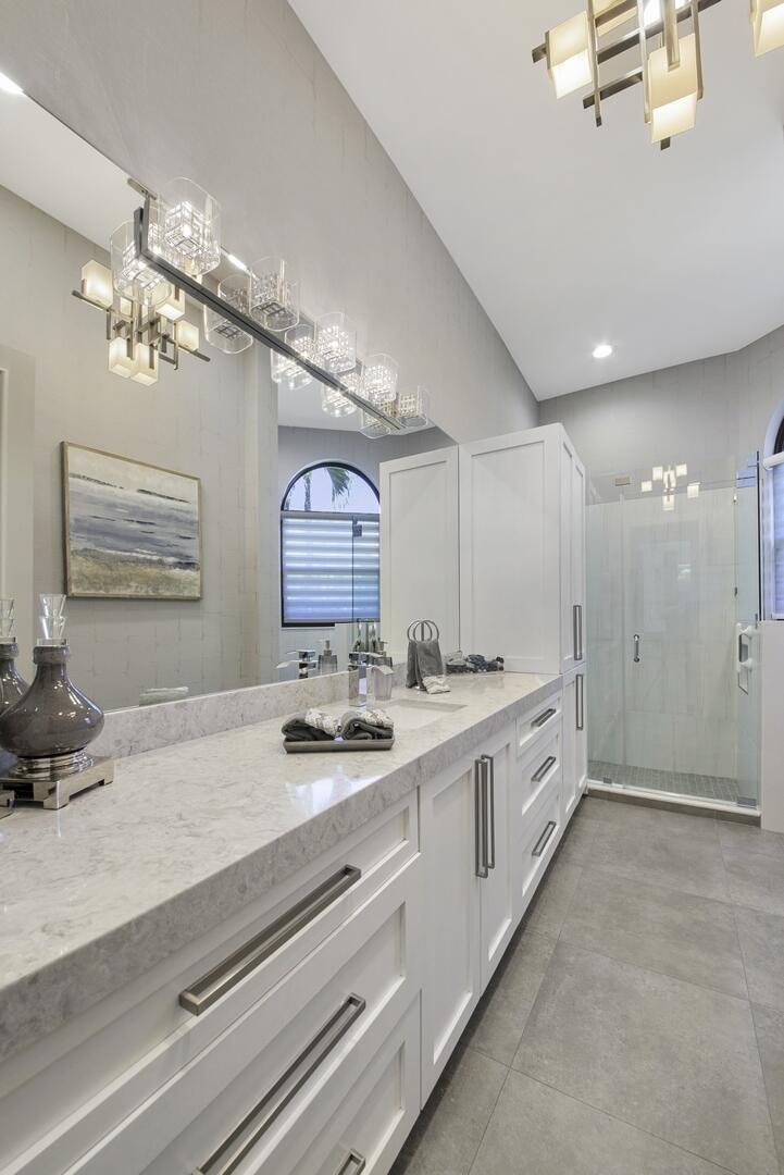 15271 Tall Oak Avenue Delray Beach, FL 33446 - Photo 48 of 60 a spacious bathroom with a double vanity sink a large mirror and shower