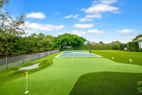 a view of a golf course with a lake