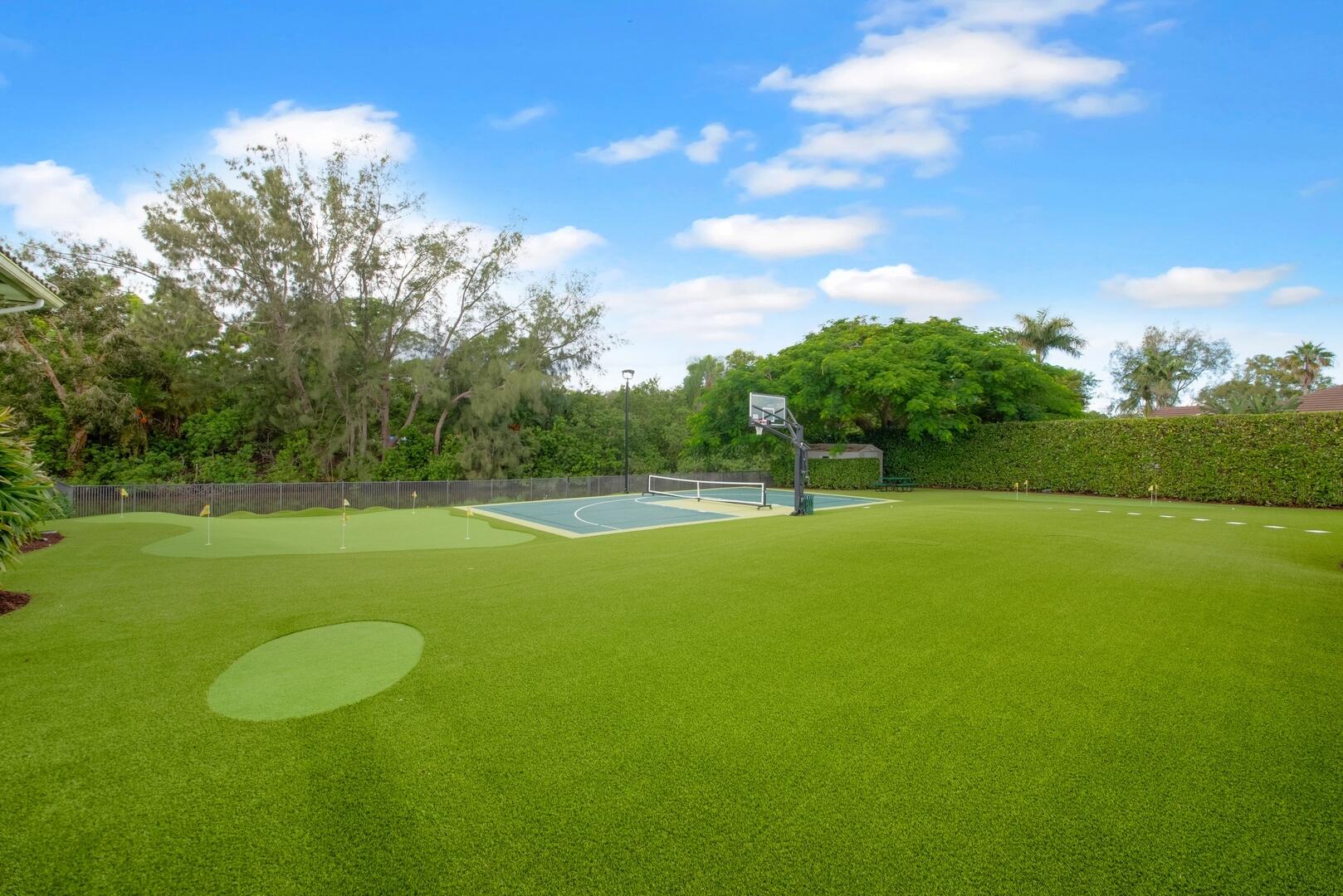 15271 Tall Oak Avenue Delray Beach, FL 33446 - Photo 6 of 60 a view of a golf course with a lake